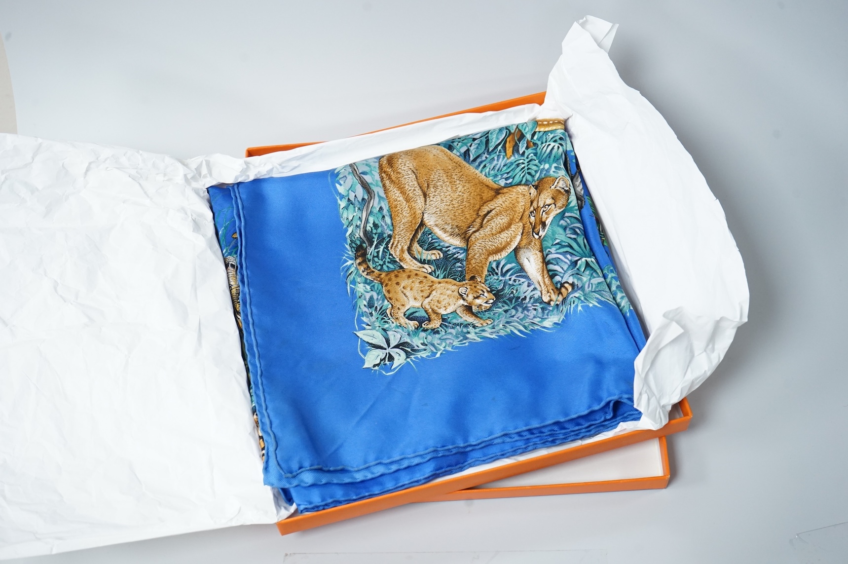 Two boxed Hermes silk scarves comprising ‘Real Escuela Andaluza del Arte Equestre’ and ‘Equateur’, with original boxes, together with four Hermes gentleman’s silk ties